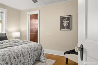 First, take in the gleaming crystal doorknob, one of those charming details you’ll notice throughout the home. And then… wait, is that really a walk-in closet? Yes it is, complete with built-in drawers and cabinetry that feel both thoughtful and delightfully unexpected.