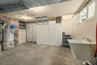An unexpected bonus down here, a newer utility sink paired with impressive built-in storage makes this space feel extra functional and thoughtfully set up.