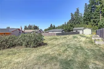 Sizable side yard with storage and gardening space!