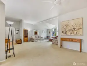 This great room connects the living areas and tall ceilings make it feel light and bright inside.