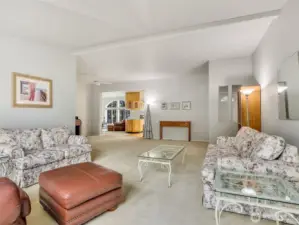 This great room connects the living areas and tall ceilings make it feel light and bright inside.