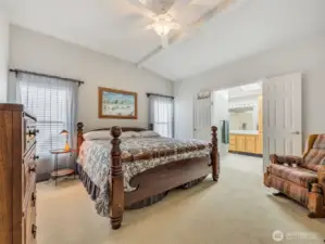 Primary bedroom with closet and attached full bathroom.