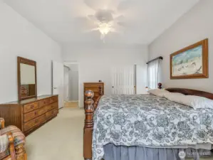 Primary bedroom with closet and attached full bathroom.