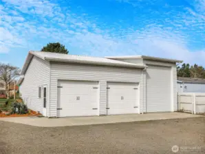 Large detached garage and shop with RV storage.