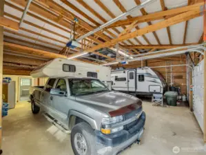 Large detached garage and shop with RV storage.