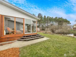 Enclosed back porch overlooking the backyard, lagoon, firepit, fish cleaning station, dock and more!