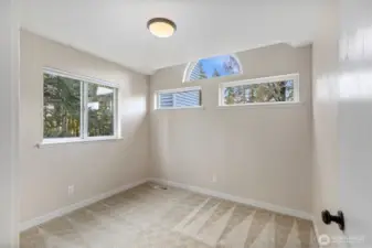 secondary bedroom with windows that give privacy but also natural light