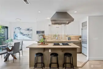 Wolf range hood & travertine counters