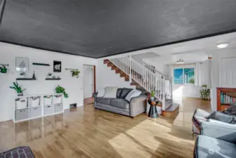 Staircase to upper level sits in the heart of the home.