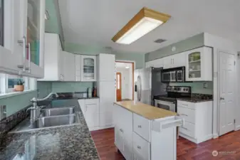 Sleek countertops complement the stainless-steel appliances.