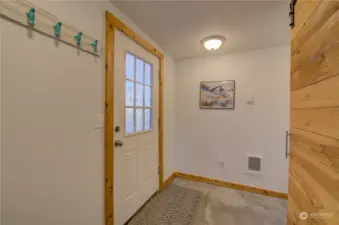 The hallway past the refrigerator goes to the 3rd sleeping room, bathroom #2, pantry, garage and fully fenced back yard.