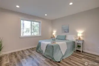 Roomy primary bedroom with private 3/4 bath and large walk-in closet