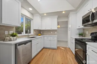 New kitchen cabinets, countertop, hardwood floors.