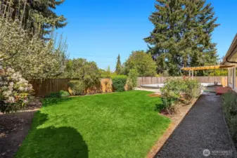 The huge backyard is totally level and offers complete privacy.