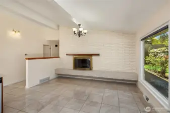 A wood-burning fireplace graces the family room.