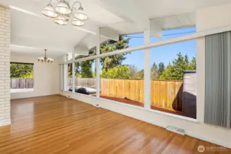 A showstopping huge bank of windows lines the dining and living rooms.