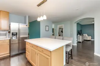 Note the arched entry into the family room.