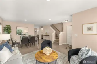 Formal living and dining area with engineered hardwood and neutral interior paint.