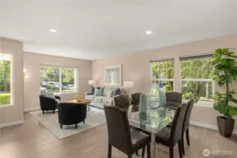 Formal living and dining with engineered hardwood floor and neutral interior paint