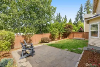 Decent sized private backyard with paver patio for kids play and gardening