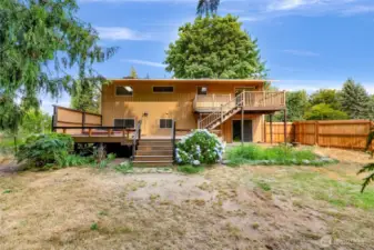The back of the home- West facing. Giant deck.