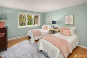 Bedroom #4 a serene retreat, looks over the front yard.