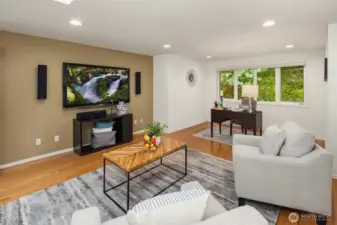 A skylight, a large window, and plenty of canned lights keep the room bright and cozy during any day or season!