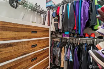 Walk in closet in primary bedroom