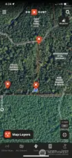 Location of the "T" at the south property line. Follow the "Land For Sale" arrow to the right when on the road. That's left if you are looking at this photo