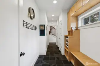 Hallway to and from Garage/Mudroom....1/2 Bath is located down the Hall.