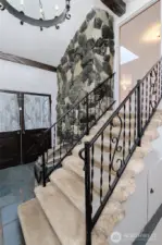 Step inside to grand foyer with vaulted ceilings and stone flooring.