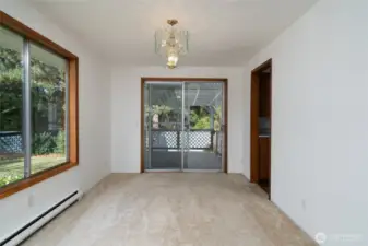 Dining room off kitchen and living room. Covered deck out slider.