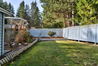 Side yard is fenced for privacy.