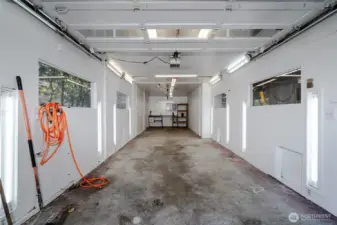 Inside one of the shop bays, ample lighting and plumbed for compressed air. This area was previously used to paint project cars.