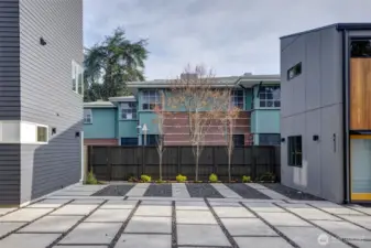 Mindful low-maintenance plantings enhance the site with natural lines and year-round color. Dedicated off-street parking for each home.