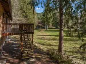 Here you can see the large deck off of the kitchen area that leads to the immense backyard and then leads to the rest of the property.