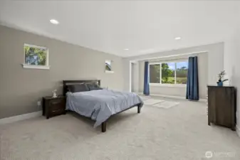 This expansive primary suite can be your own private retreat.