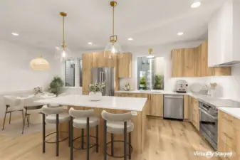 A kitchen designed to gather — generous island, custom cabinetry, and quartz counters.