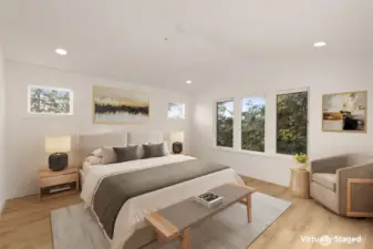 A calm, comfortable primary suite retreat with designer finishes and oversized windows.
