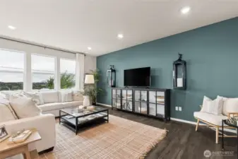 Extended low maintenance laminate flooring in entry, family room, kitchen and dining room. Photos are for representational purposes only.  Colors and finishes may vary.