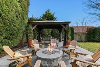 Sit around the backyard firepit on warm evenings.