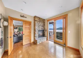Main floor office/bedroom with views and fireplace