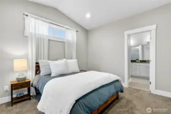 Main floor primary bedroom with en-suite bath and walk-in closet.