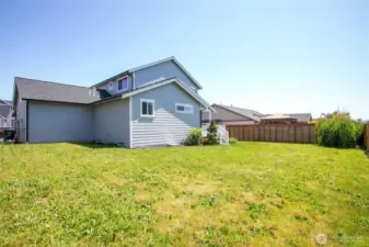 Backyard has a privacy fence borders all 3 neighbors.
