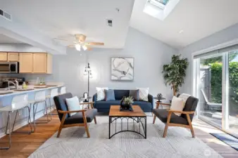Beautiful living area with sliding doors to the patio and a bar for eating spacce.