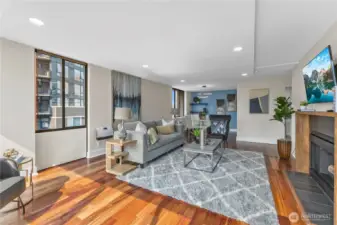 Expansive great room with engineered hardwood floors and open-concept design.