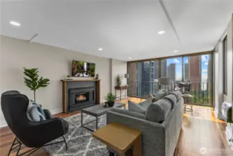 Wall of windows frames iconic Seattle skyline views from your own living room.