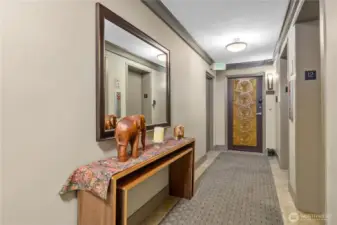 A warm and inviting entrance to the condo on 12th floor.