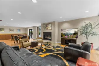 Bright, open gathering space with comfortable seating and dining area for hosting events.