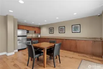 Fully equipped community kitchen with stainless steel appliances and plenty of prep space.